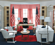 White chairs, pink curtains, desk in the middle with a black chair, red carpet, all IKEA--meaning, both colorful and cheap looking