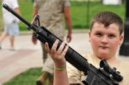 boy holding assault rifle