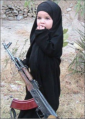 Very young girl with gun