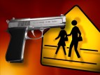 Pistol and yellow school crossing sign